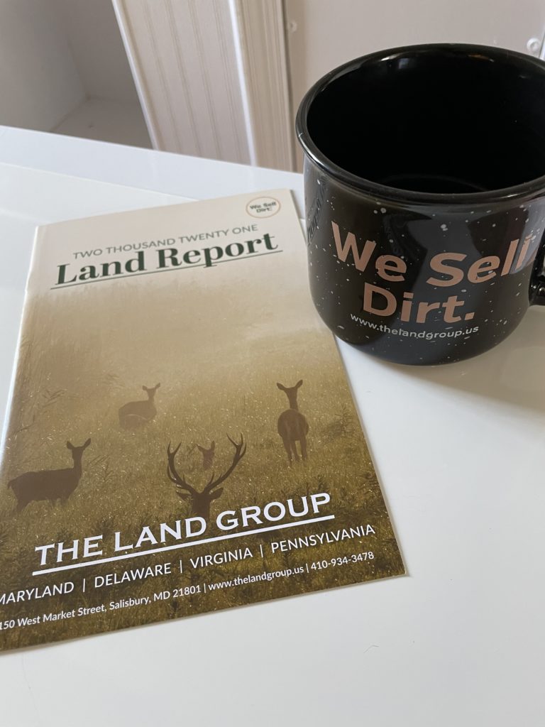 2021 land report picture and coffee mug