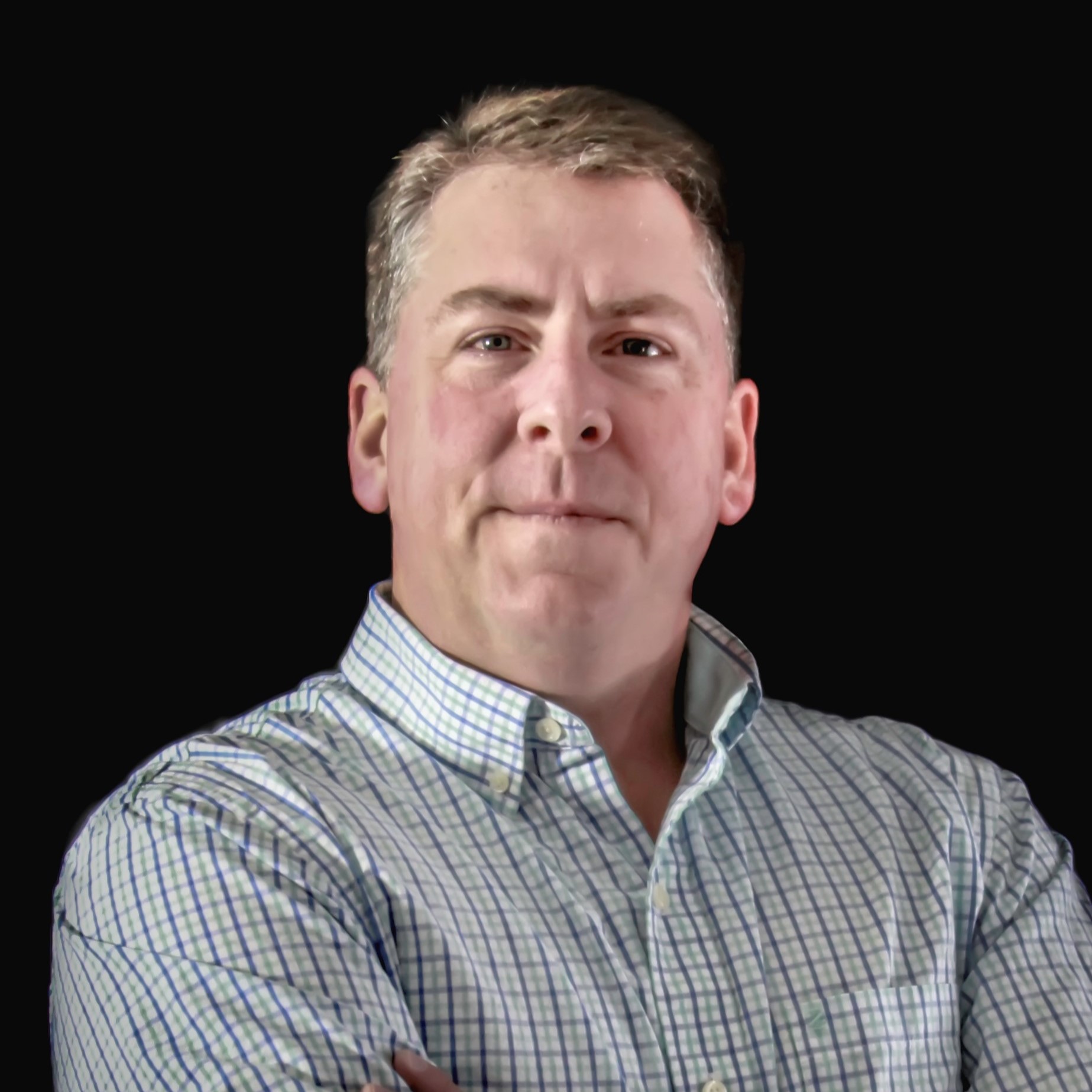 a man with his arms crossed in front of a black background