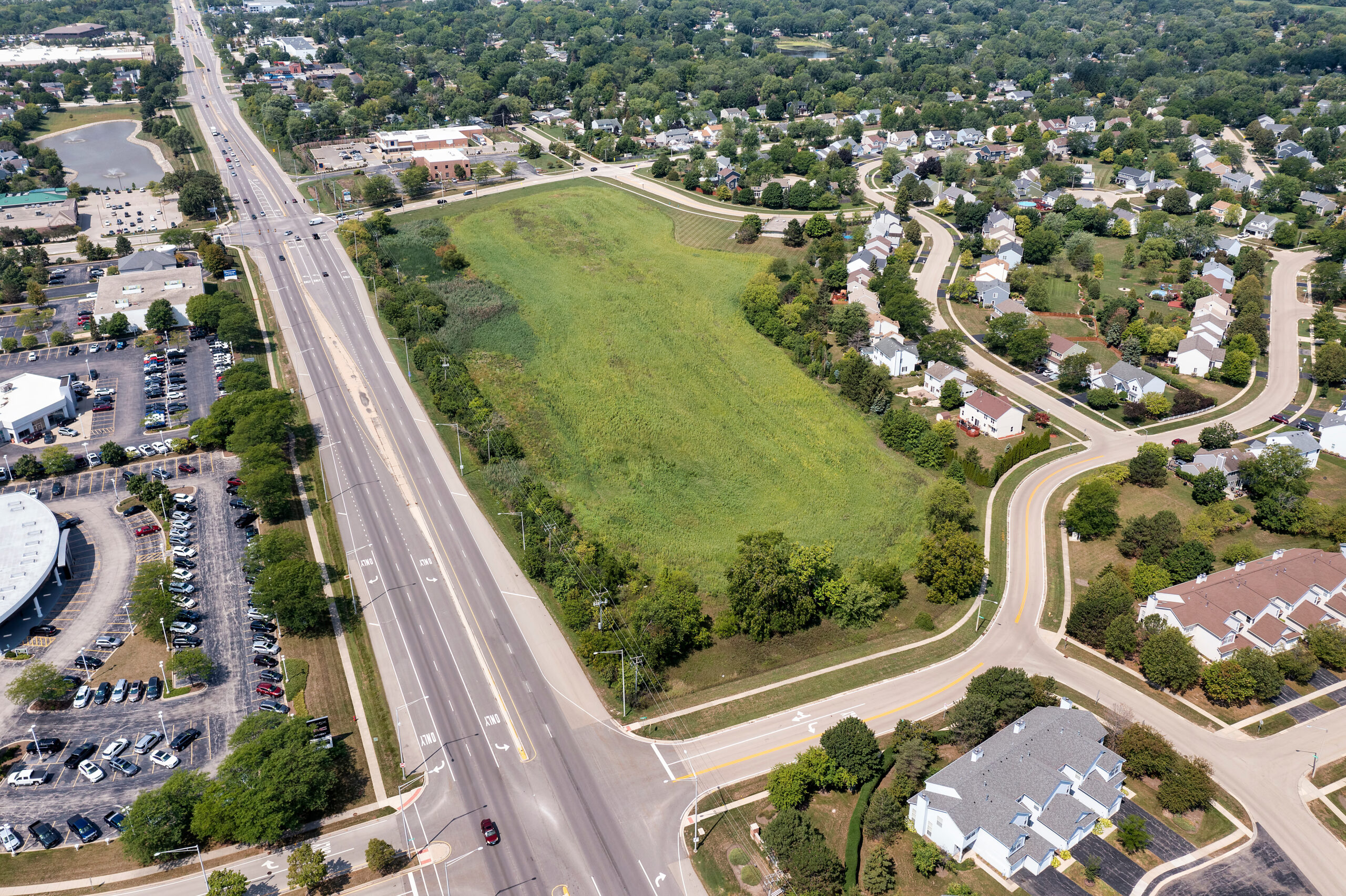an aerial view of a large green field