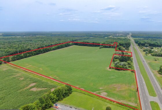 an aerial view of a large green field