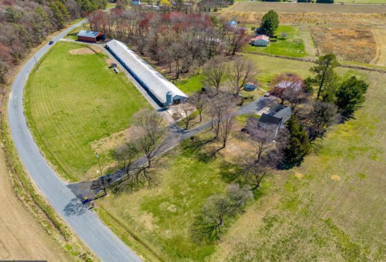 an aerial view of a farm in the country