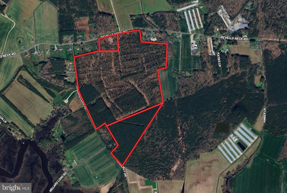 an aerial view of a red area in the middle of a field