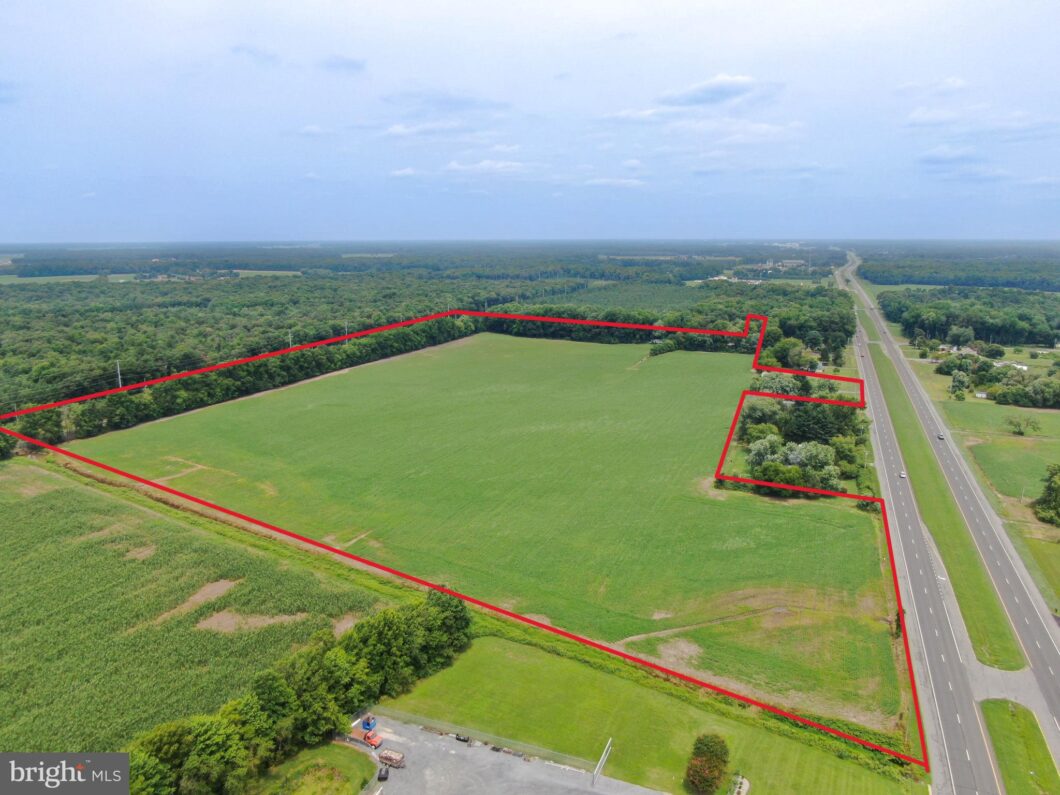 an aerial view of a large green field