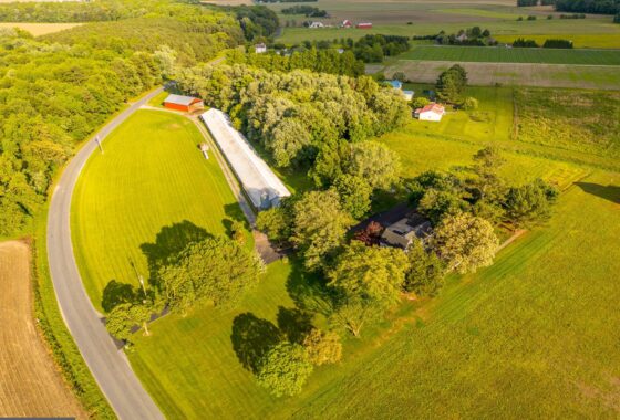 an aerial view of a farm in the country