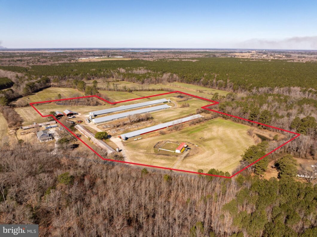 an aerial view of a farm and farm land
