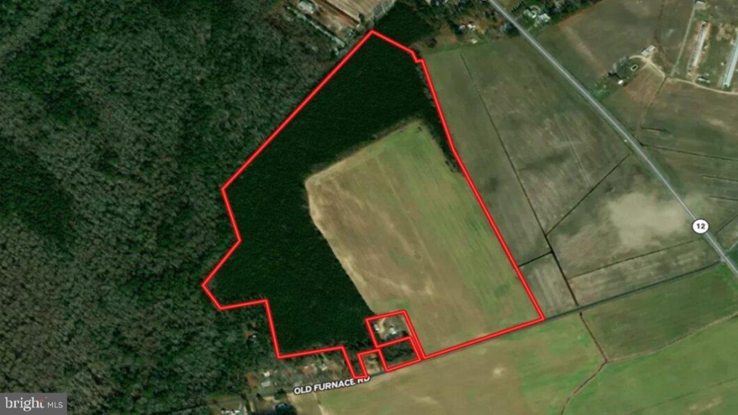 an aerial view of a field with a red line
